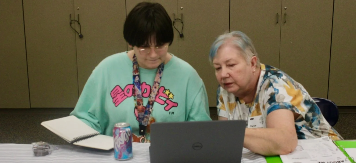 Mentor and mentee working hard to finish school work. 